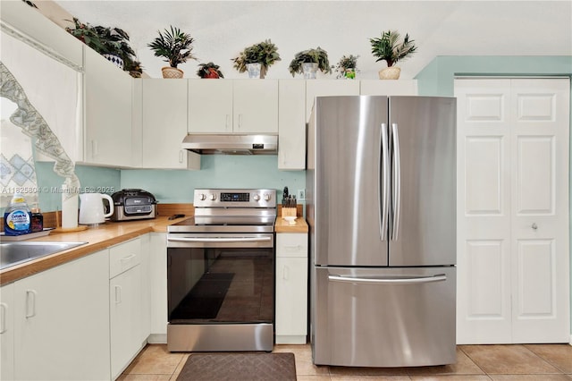 11027 SW 148th Ct, Miami, FL 33196 - kitchen featuring stainless steel appliances, under cabinet range hood, light tile patterned floors, and white cabinets