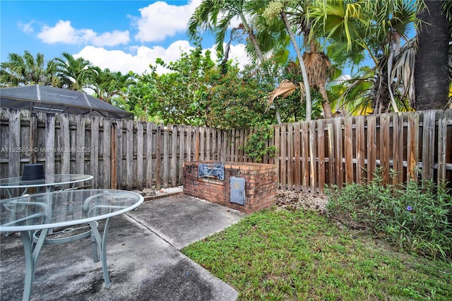 11027 SW 148th Ct, Miami, FL 33196 - fenced backyard with a patio area and outdoor dining space