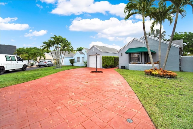 11027 SW 148th Ct, Miami, FL 33196 - view of front of property featuring stucco siding, decorative driveway, and a garage