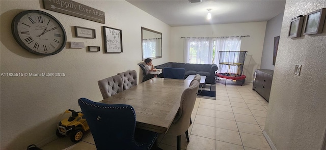 14111 SW 49th St Unit 8, Miramar, FL 33027 - dining room featuring a textured wall and light tile patterned floors