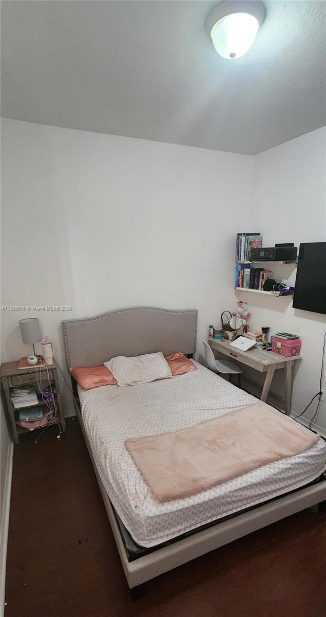 14111 SW 49th St Unit 8, Miramar, FL 33027 - bedroom featuring wood finished floors