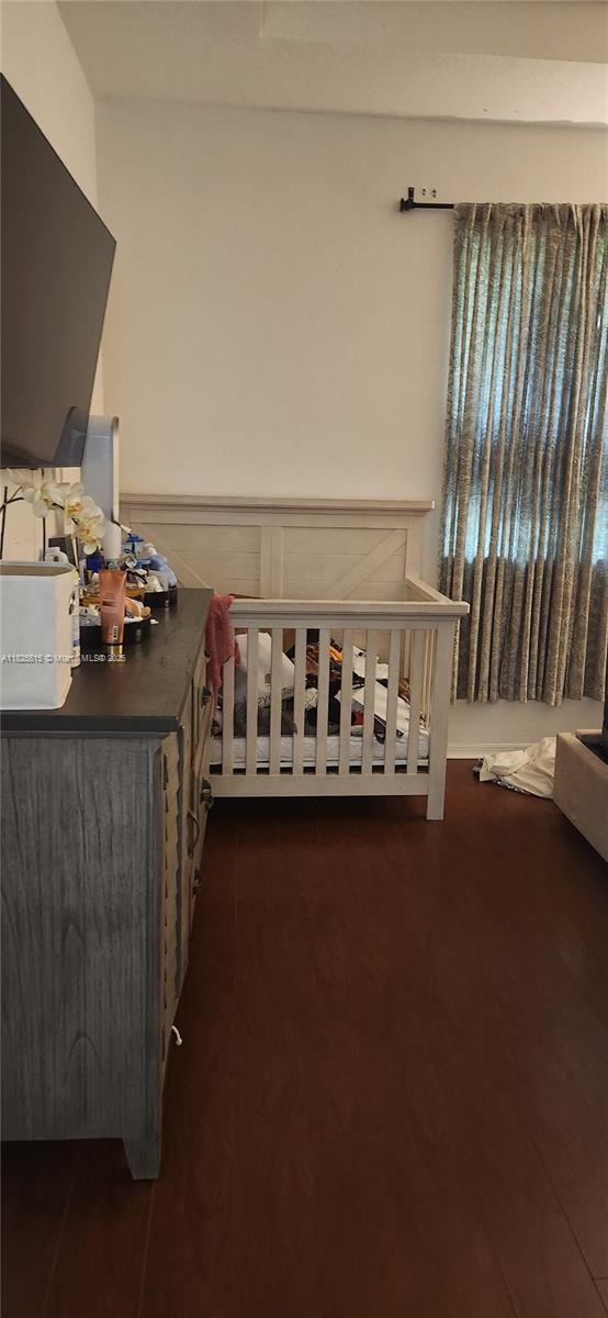 14111 SW 49th St Unit 8, Miramar, FL 33027 - bedroom featuring dark wood-style floors