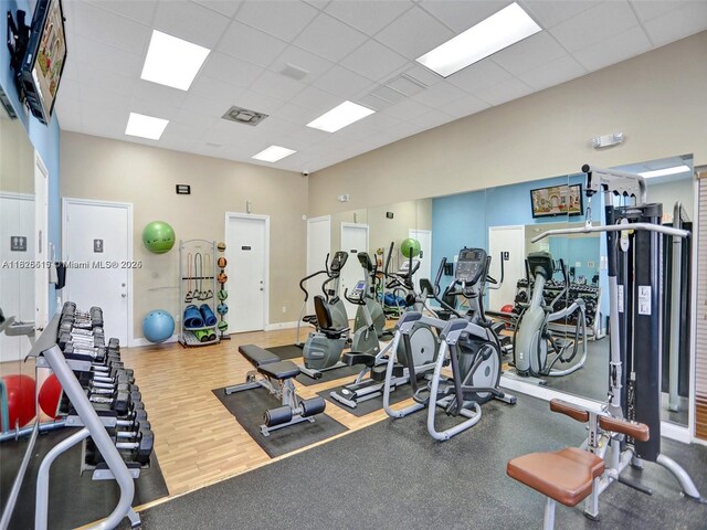 14111 SW 49th St Unit 8, Miramar, FL 33027 - exercise room featuring a paneled ceiling and wood finished floors