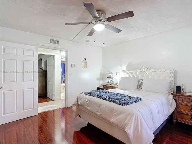 8635 NW 8th St Unit 103, Miami, FL 33126 - bedroom with wood finished floors, a textured ceiling, and ceiling fan