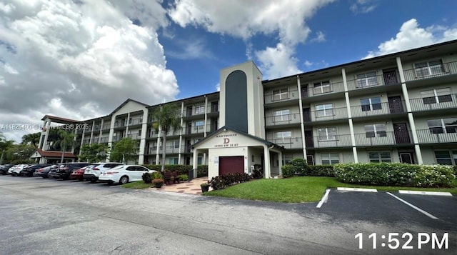 12950 SW 13th St Unit 301D, Pembroke Pines, FL 33027 - view of apartment building / complex featuring uncovered parking