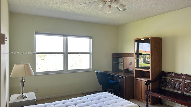 12950 SW 13th St Unit 301D, Pembroke Pines, FL 33027 - bedroom featuring carpet flooring, a textured ceiling, and a ceiling fan