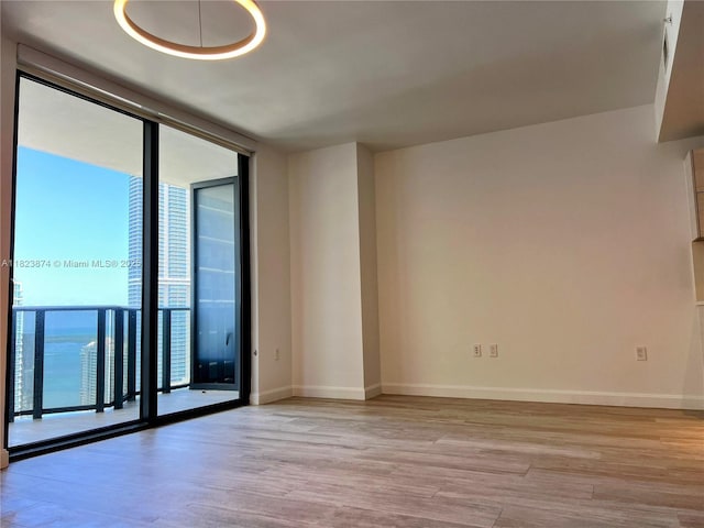 45 SW 9th St Unit 3602, Miami, FL 33130 - spare room featuring light wood-style flooring and floor to ceiling windows