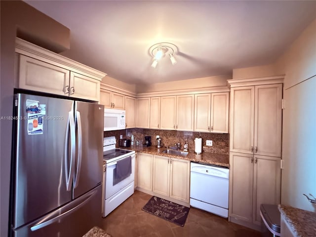 1950 S Ocean Dr Phh, Phh, Hallandale Beach, FL 33009 - kitchen with white appliances, backsplash, dark stone counters, and dark tile patterned floors