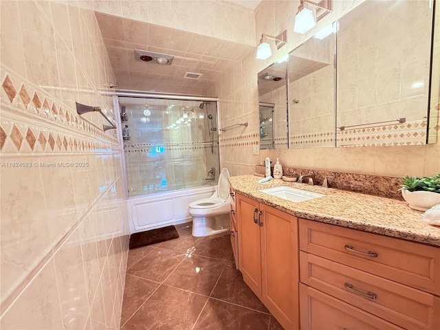 1950 S Ocean Dr Phh, Phh, Hallandale Beach, FL 33009 - full bath featuring tile walls, vanity, combined bath / shower with glass door, and tile patterned flooring