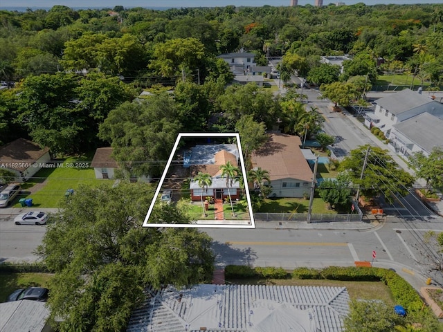 3490 Charles Ave, Miami, FL 33133 - aerial view of property and surrounding area with property parcel outlined and a forest