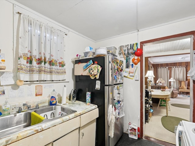 3490 Charles Ave, Miami, FL 33133 - kitchen with freestanding refrigerator, light countertops, and crown molding