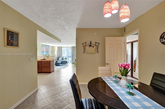 7100 NW 17th St Unit 402, Plantation, FL 33313 - dining room with baseboards and light tile patterned floors