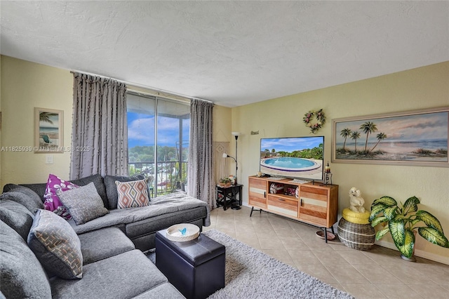 7100 NW 17th St Unit 402, Plantation, FL 33313 - living room featuring tile patterned floors and a textured ceiling