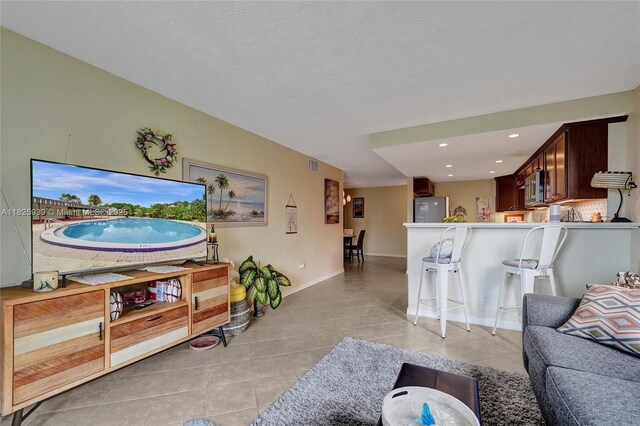 7100 NW 17th St Unit 402, Plantation, FL 33313 - living room with light tile patterned flooring and recessed lighting
