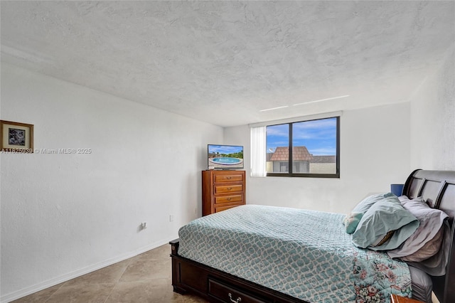 7100 NW 17th St Unit 402, Plantation, FL 33313 - bedroom featuring a textured ceiling
