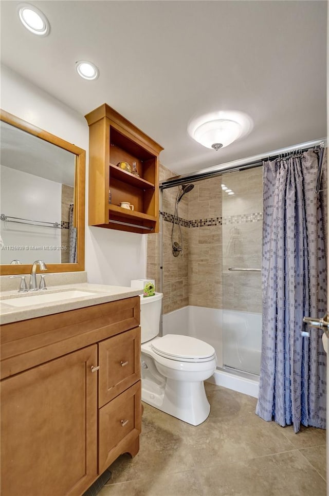 7100 NW 17th St Unit 402, Plantation, FL 33313 - bathroom featuring a shower stall, vanity, and recessed lighting