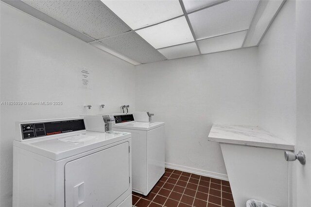 7100 NW 17th St Unit 402, Plantation, FL 33313 - communal laundry room with separate washer and dryer and dark tile patterned floors