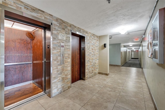 7100 NW 17th St Unit 402, Plantation, FL 33313 - hall with elevator and tile patterned floors