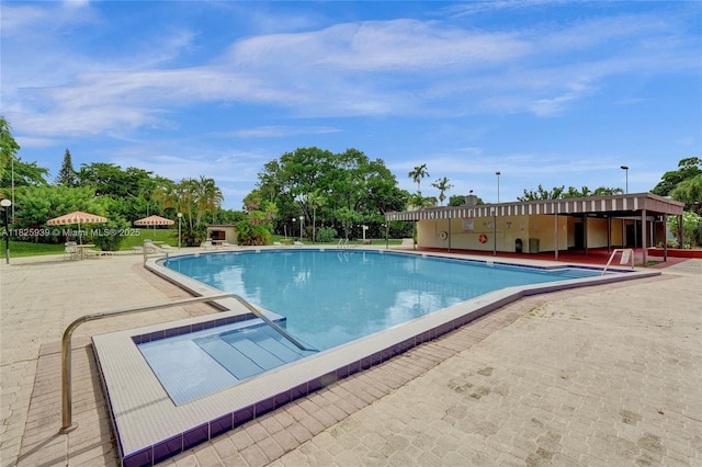 7100 NW 17th St Unit 402, Plantation, FL 33313 - community pool featuring a patio area