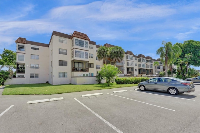7100 NW 17th St Unit 402, Plantation, FL 33313 - view of apartment building / complex with uncovered parking