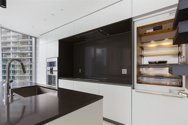 300 Biscayne Blvd Way Unit 2607, Miami, FL 33131 - kitchen featuring white cabinets, modern cabinets, black electric stovetop, and open shelves