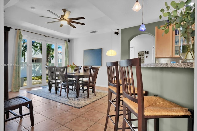 12779 SW 27th St, Miramar, FL 33027 - dining space with a ceiling fan, light tile patterned flooring, and arched walkways