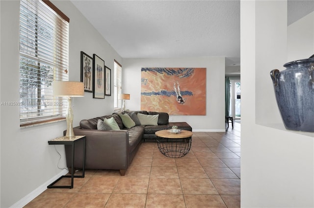 12779 SW 27th St, Miramar, FL 33027 - living room with light tile patterned floors and a textured ceiling