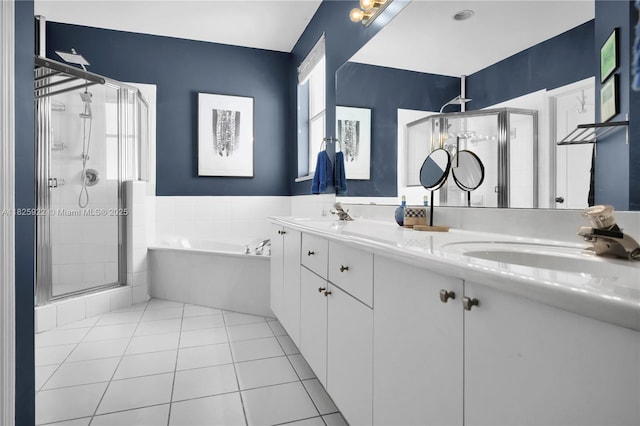 12779 SW 27th St, Miramar, FL 33027 - bathroom featuring a shower stall, a bath, double vanity, and healthy amount of natural light