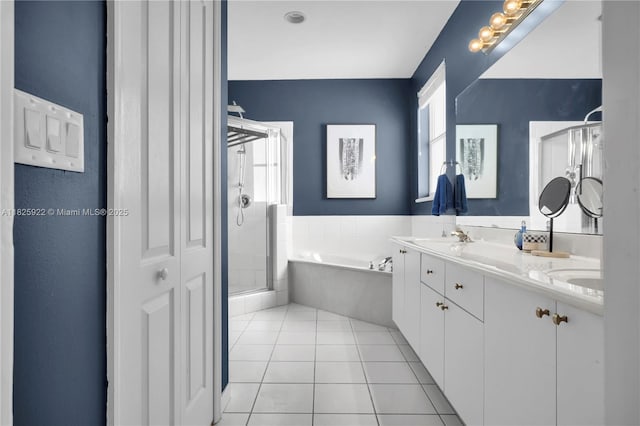 12779 SW 27th St, Miramar, FL 33027 - full bathroom with a shower stall, a garden tub, tile patterned floors, and double vanity