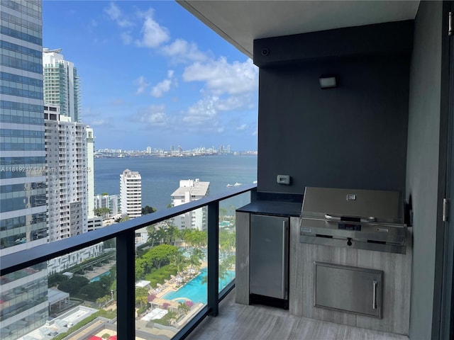 1451 Brickell Ave Unit 2306, Miami, FL 33131 - balcony with a grill, a view of city, a water view, and view of pool area