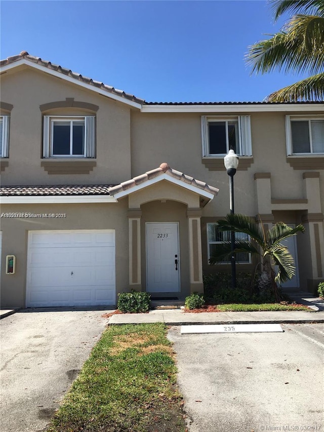 2233 SE 24th Pl Unit 2233, Homestead, FL 33035 - multi unit property featuring stucco siding, a tile roof, and a garage