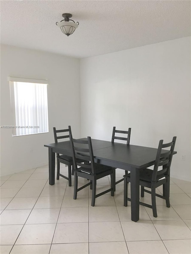 2233 SE 24th Pl Unit 2233, Homestead, FL 33035 - dining area featuring a textured ceiling and light tile patterned flooring