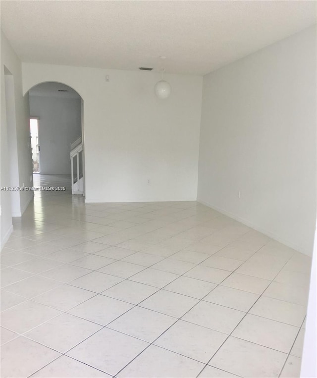 2233 SE 24th Pl Unit 2233, Homestead, FL 33035 - unfurnished room featuring arched walkways and light tile patterned flooring