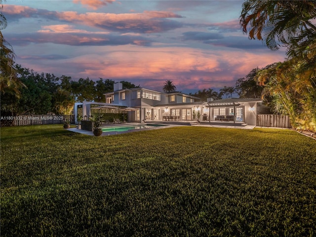 441 Grand Concourse, Miami Shores, FL 33138 - back of house at dusk featuring a pergola, a patio, and french doors