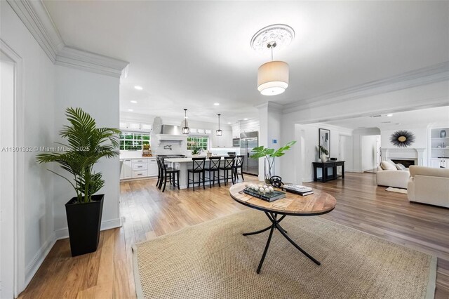 441 Grand Concourse, Miami Shores, FL 33138 - living area featuring ornamental molding, light wood-style flooring, a fireplace, and recessed lighting
