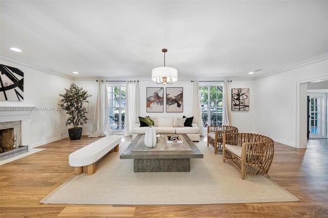 441 Grand Concourse, Miami Shores, FL 33138 - living area with wood finished floors, a fireplace, ornamental molding, and recessed lighting