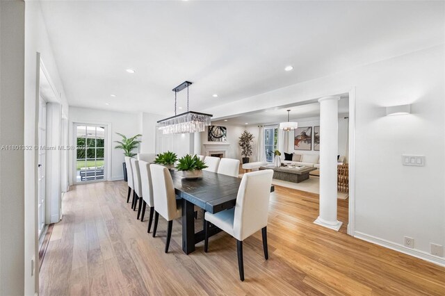 441 Grand Concourse, Miami Shores, FL 33138 - dining room featuring light wood-style floors, recessed lighting, and decorative columns