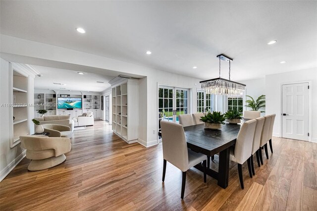 441 Grand Concourse, Miami Shores, FL 33138 - dining room featuring wood finished floors, recessed lighting, and a chandelier