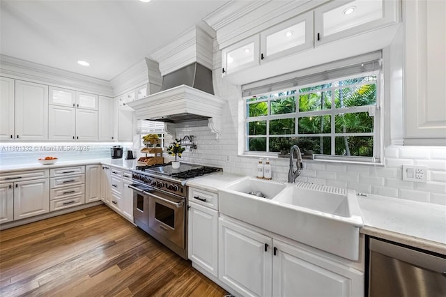 441 Grand Concourse, Miami Shores, FL 33138 - kitchen featuring appliances with stainless steel finishes, decorative backsplash, light countertops, recessed lighting, and crown molding