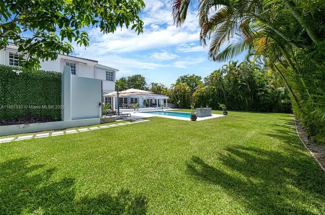 441 Grand Concourse, Miami Shores, FL 33138 - view of green lawn with an outdoor pool