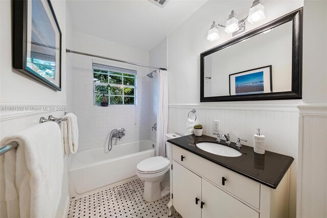441 Grand Concourse, Miami Shores, FL 33138 - bathroom with a wainscoted wall, vanity, and shower / bathtub combination with curtain