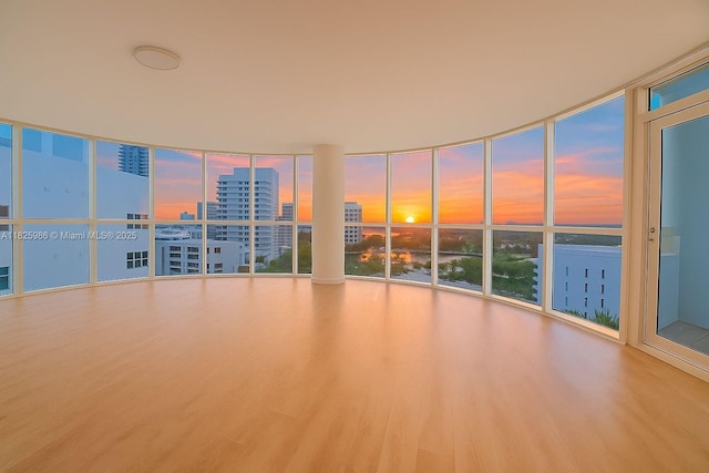 6301 Collins Ave Unit 1005, Miami Beach, FL 33141 - unfurnished room featuring a city view, wood finished floors, and expansive windows