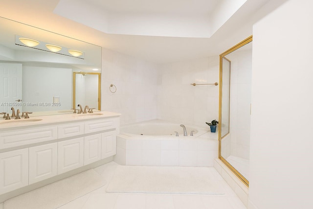 6301 Collins Ave Unit 1005, Miami Beach, FL 33141 - bathroom featuring a garden tub, tile patterned flooring, double vanity, and a shower
