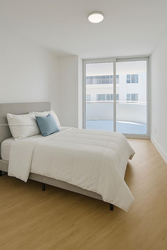 6301 Collins Ave Unit 1005, Miami Beach, FL 33141 - bedroom with wood finished floors and baseboards
