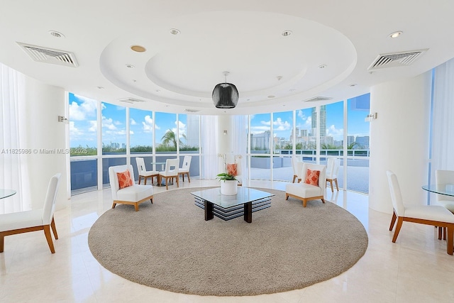 6301 Collins Ave Unit 1005, Miami Beach, FL 33141 - living area featuring expansive windows, recessed lighting, a tray ceiling, and light tile patterned floors
