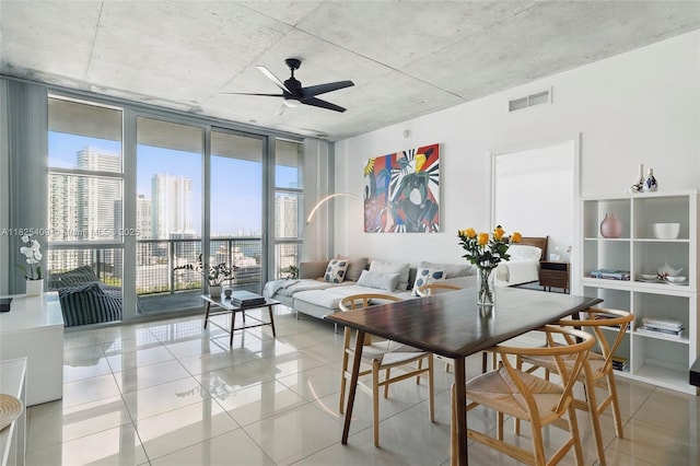 3301 NE 1st Ave Unit H2104, Miami, FL 33137 - dining space featuring expansive windows, light tile patterned flooring, a ceiling fan, and a city view