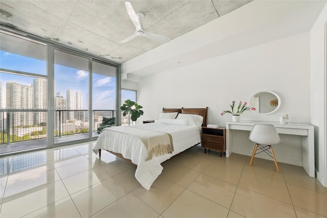 3301 NE 1st Ave Unit H2104, Miami, FL 33137 - bedroom with expansive windows, light tile patterned floors, ceiling fan, a skyline view, and access to exterior