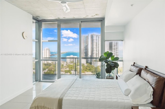 3301 NE 1st Ave Unit H2104, Miami, FL 33137 - bedroom with expansive windows, a water view, and tile patterned flooring