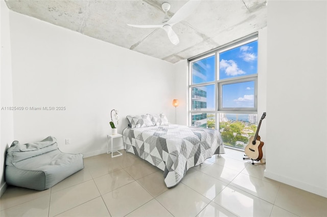 3301 NE 1st Ave Unit H2104, Miami, FL 33137 - bedroom featuring floor to ceiling windows, light tile patterned floors, and a ceiling fan