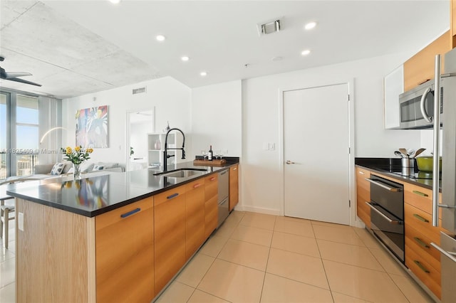 3301 NE 1st Ave Unit H2104, Miami, FL 33137 - kitchen featuring appliances with stainless steel finishes, dark countertops, open floor plan, modern cabinets, and recessed lighting